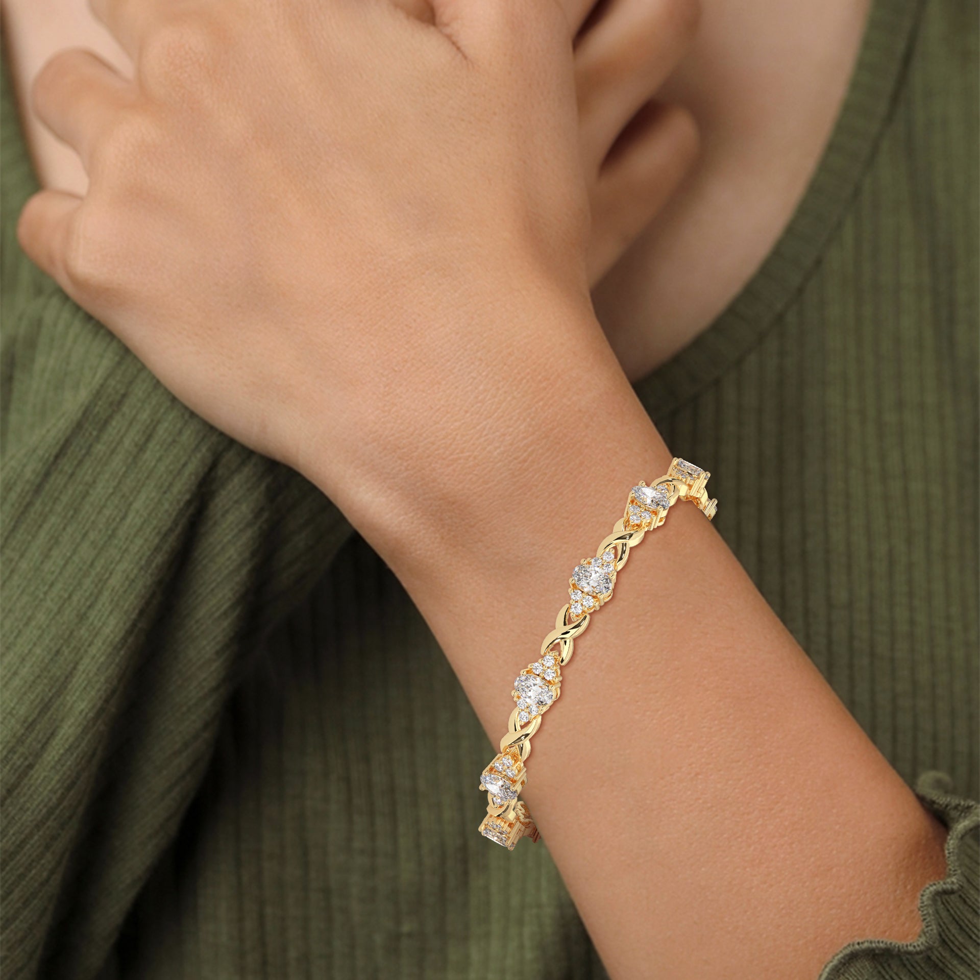 Oval Sapphire & Diamond Infinity Bracelet in yellow gold