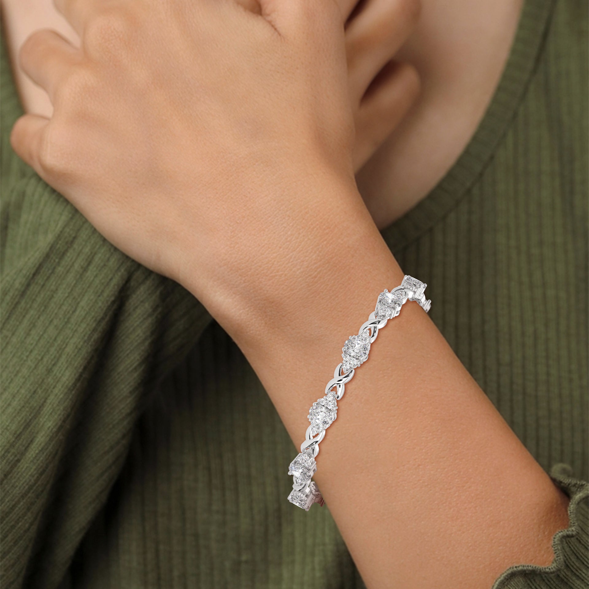 Oval Sapphire & Diamond Infinity Bracelet in white gold