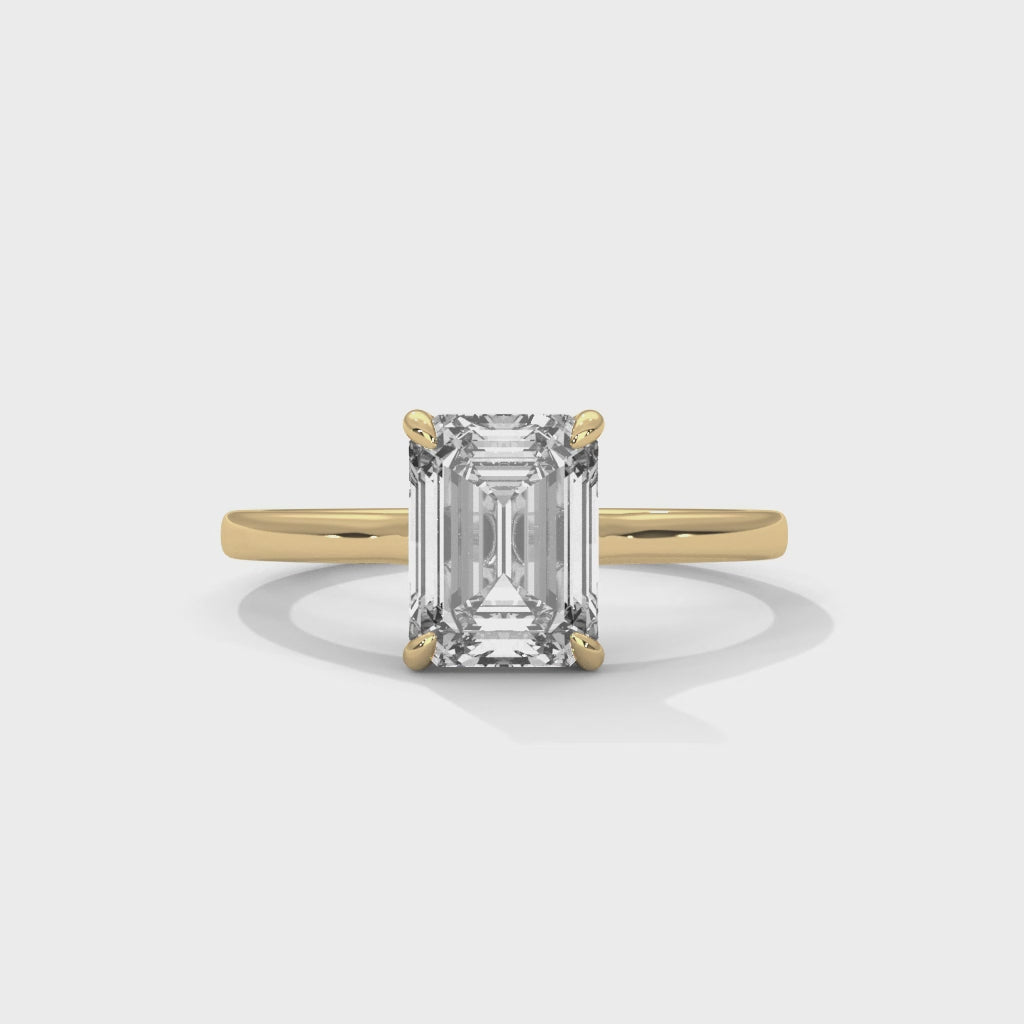 Giselle emerald-cut solitaire diamond engagement ring, 14k yellow gold, 360 view
