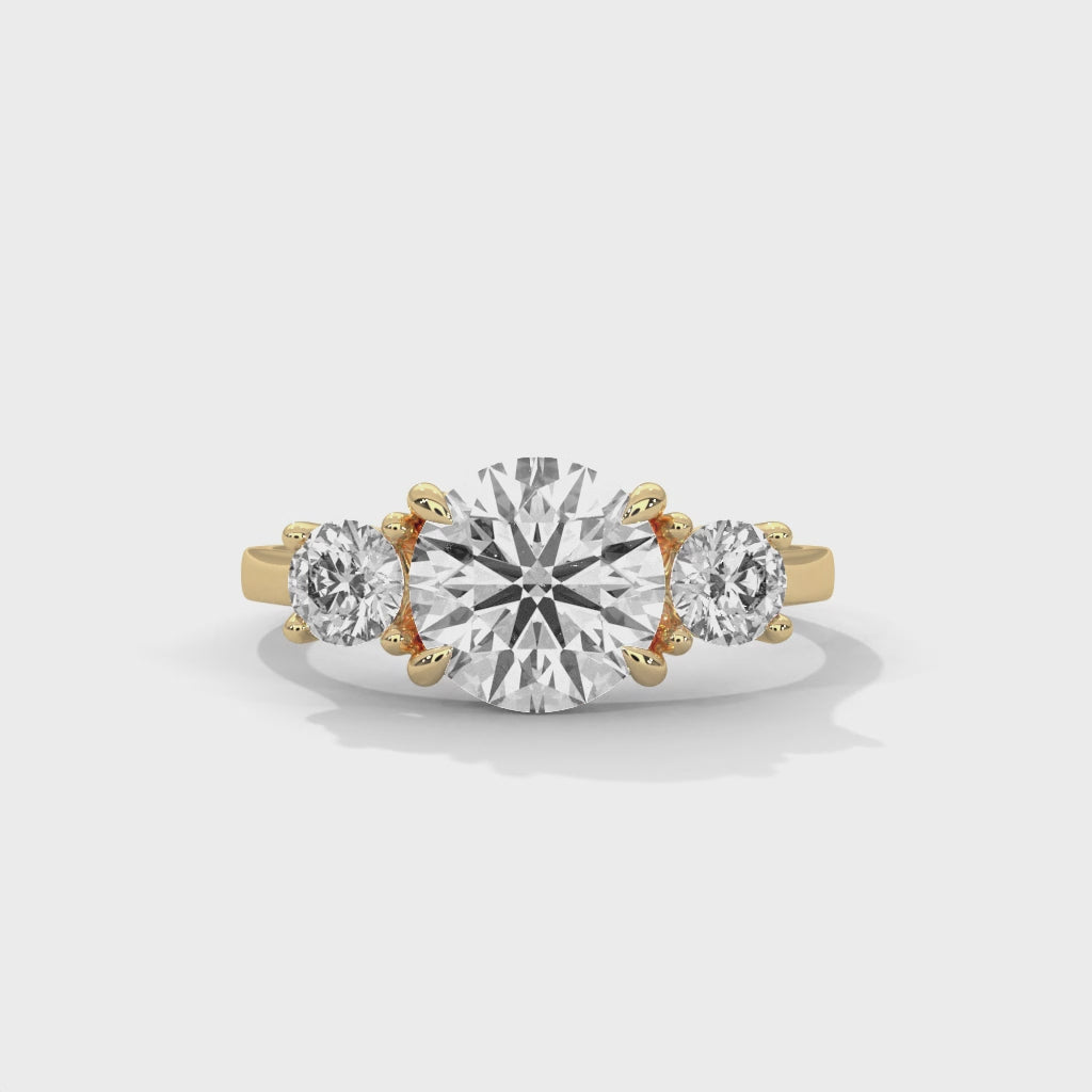 Fleur three-stone round diamond engagement ring, 14k yellow gold, 360 view